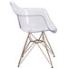 A Flash Furniture Alonza clear plastic side chair with a gold base.