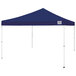 A navy Caravan Canopy tent with white poles.