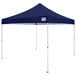 A navy Caravan Canopy tent with white poles.