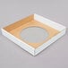 A white cardboard square with a circle inside.