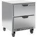 A Beverage-Air stainless steel undercounter freezer with drawers on wheels.
