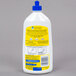 A white SC Johnson Pledge Squirt and Mop multi-surface floor care cleaner bottle with a blue lid and yellow label.
