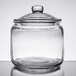 A Choice 0.75 gallon glass jar with a lid on a table.