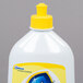 A white bottle of SC Johnson Pledge Squirt and Mop Hardwood Floor Care Cleaner with a yellow cap.