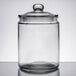 A clear glass Choice 0.5 Gallon Glass Jar with a black lid.