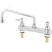 A chrome T&S deck mounted workboard faucet with lever handles.
