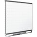 A Quartet whiteboard with a grid on it and a black frame.