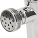 A T&S chrome plated wall mounted metering faucet with push button cap.