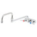 A T&S chrome wall mount faucet with double-jointed swing spout and lever handles.