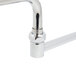 A T&S chrome wall mounted workboard faucet with double-jointed swing spout and lever handles.