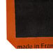 A black and orange label with the words "Made in France" on a white background.