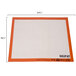 A white and orange Sasa Demarle SILPAT full size baking mat with measurements in black.