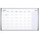 A white magnetic steel Quartet calendar with silver aluminum frame and black and blue lines.