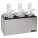 A San Jamar stainless steel condiment pump service center with three white plastic spouts.