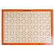 A white Sasa Demarle SILPAT® baking mat with orange circles.
