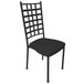 A black metal Holland Bar Stool stackable chair with a black seat.