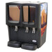 A black Crathco refrigerated beverage dispenser with three drink bowls and an iced coffee decal.