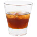 A Libbey stackable rocks glass with brown liquid and ice.