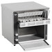 A silver Vollrath conveyor toaster with the lid open on a counter.
