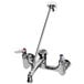 A chrome T&S mop sink faucet with two lever handles and a garden hose outlet.