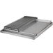 A stainless steel 24" x 27" Add-On Griddle / Broiler Top on a metal grill.