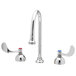 A T&S medical faucet with two swivel gooseneck spouts and wrist handles.