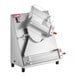 A stainless steel countertop two stage dough sheeter with a slanted design and clear safety guards.