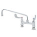 A white T&S deck-mounted pantry faucet with wrist handles and a swing spout.