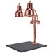 A Hanson bright copper carving station with two lamps over a black granite surface.