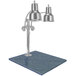 A silver Hanson Heat Lamps dual bulb carving station on a blue granite base.