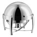 A round, stainless steel chafing dish with a domed roll-top lid and three curved legs.
