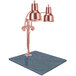 A Hanson Heat Lamps bright copper carving station with natural granite base.