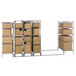 A Metro qwikTRAK stainless steel mobile shelving unit with boxes on wheels.