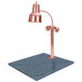 A Hanson Heat Lamps bright copper carving station with natural granite base.