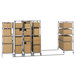 A Metro Super Erecta stainless steel stationary intermediate shelving unit with boxes.