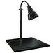 A Hanson Heat Lamps black single lamp carving station on a black surface.