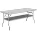 A gray rectangular Regency stainless steel folding table with a shelf.