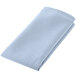 A folded light blue cloth with stitched edges.