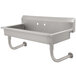A stainless steel Advance Tabco multi-station hand sink with two holes and hooks on the side.