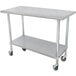 A silver metal Advance Tabco work table with wheels.