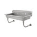 A stainless steel Advance Tabco multi-station hand sink with two holes on the side.