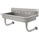 A stainless steel Advance Tabco hand sink with two holes.