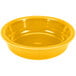 A close up of a yellow Fiesta china bowl.