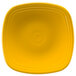 A yellow square Fiesta luncheon plate with a white circle in the center.