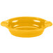 A yellow oval casserole dish with handles on a white background.