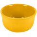 A close up of a Fiesta Daffodil yellow bowl on a white background.