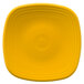 A yellow square Fiesta plate with a white center.