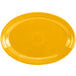 A yellow oval platter with a white background and a yellow circle in the middle.