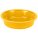 A close up of a Fiesta Daffodil yellow serving bowl.
