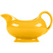 A yellow ceramic Fiesta sauce boat with a handle.